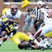 Michigan quarterback Devin Gardner is brought down by Central Michigan cornerback Jason Wilson and linebacker Justin Cherocci during the first half at Michigan Stadium on Saturday, August 31, 2013. Melanie Maxwell | AnnArbor.com